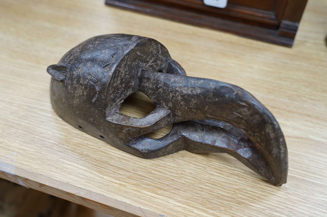 A Chokwe tribe bird mask, 32cm long. Condition - good